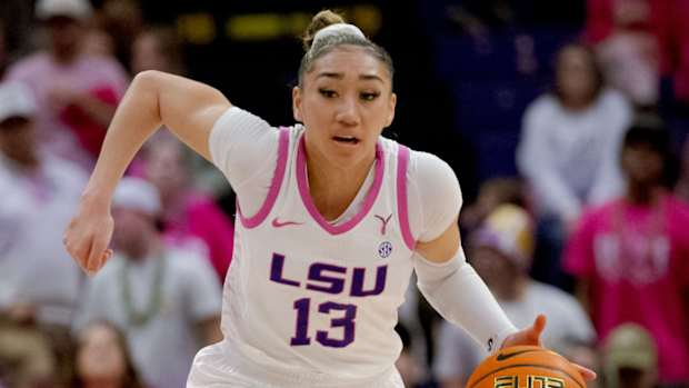 LSU guard Last-Tear Poa runs the ball to the hoop.